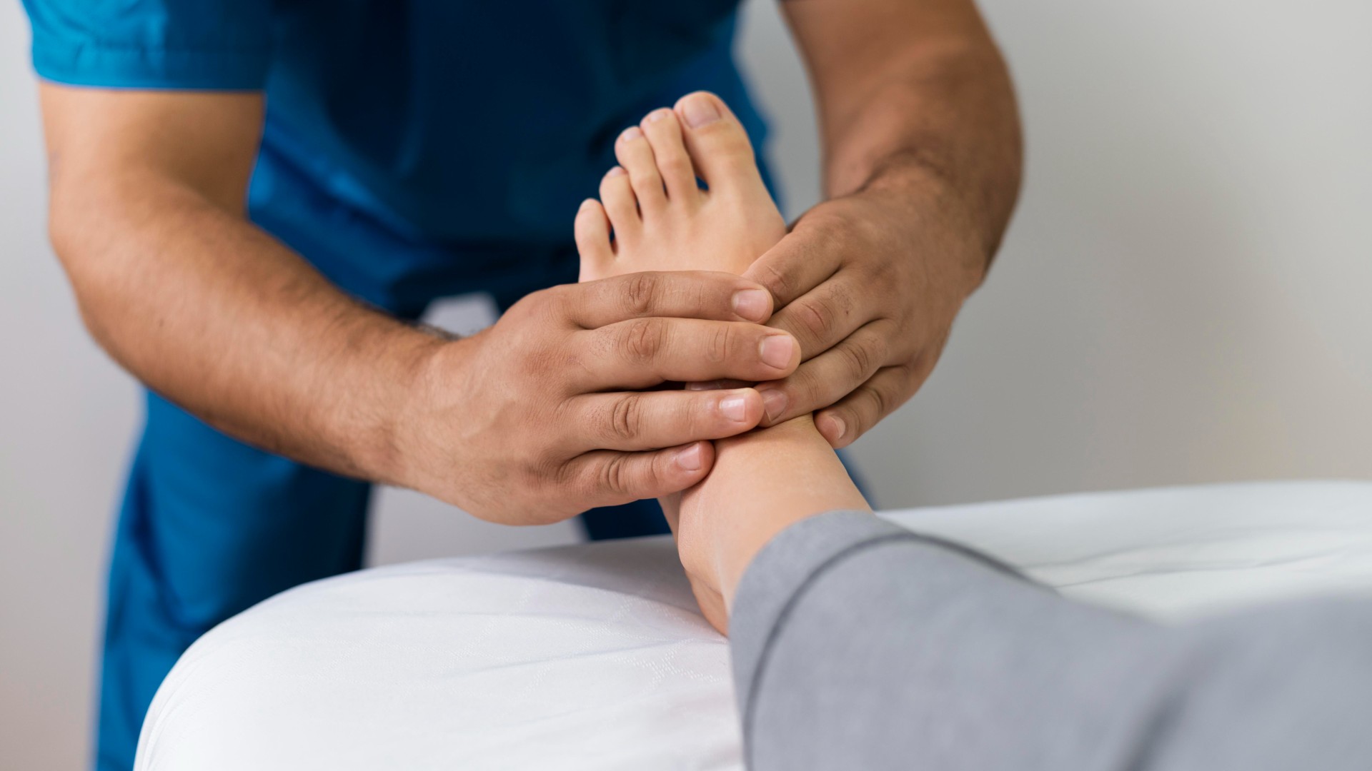 Close-up of a foot being assessed by a specialist