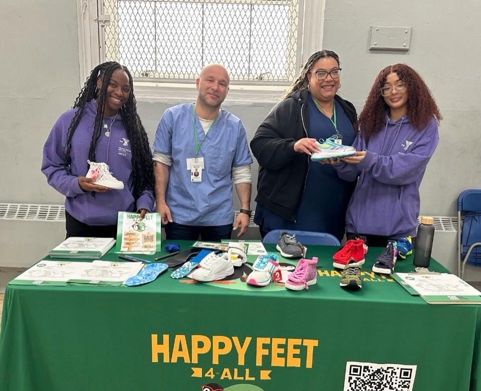 Happy Feet 4 All team running an on-site screening at a school