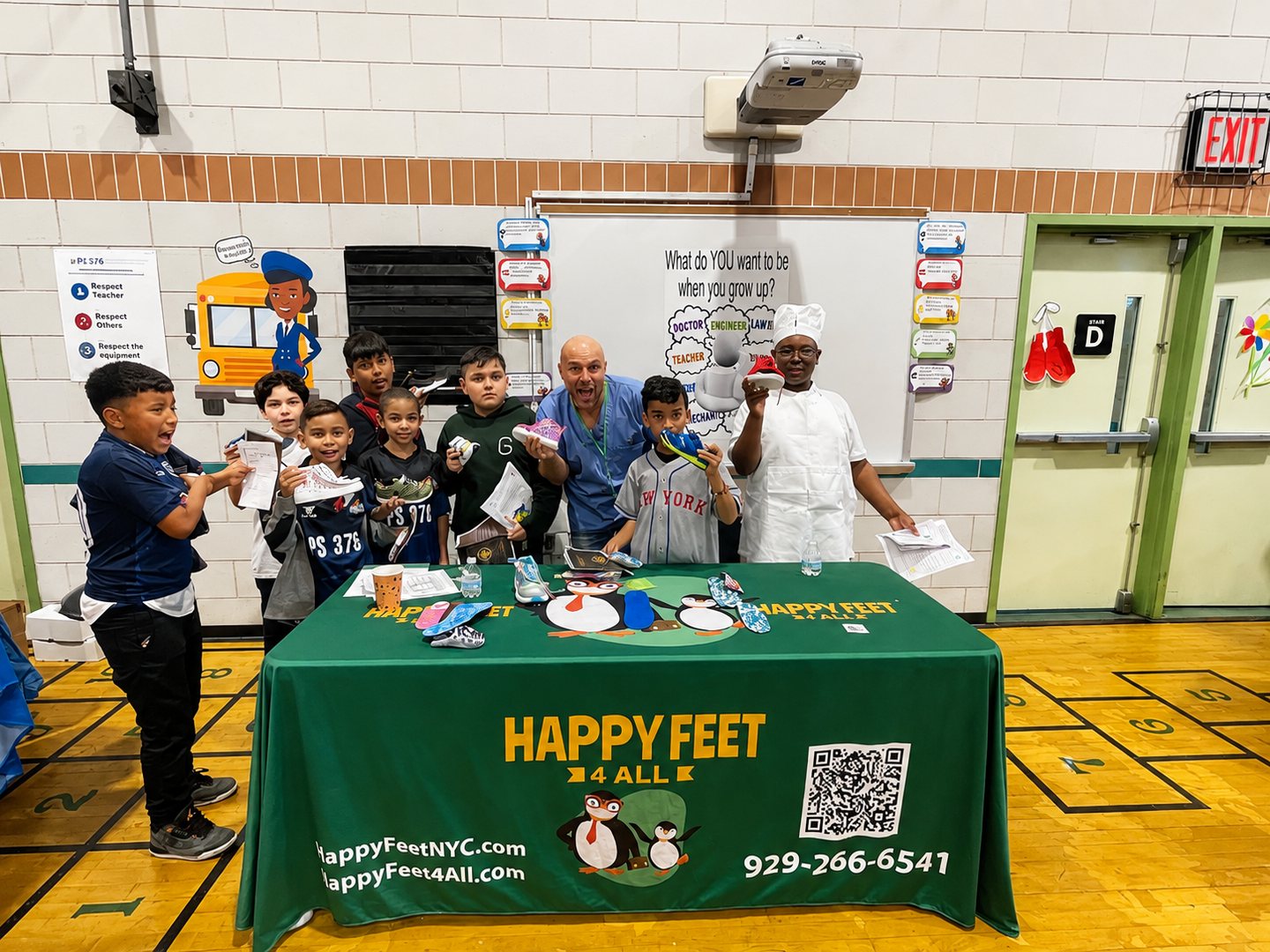 Children with the Happy Feet 4 All team at an on-site screening event